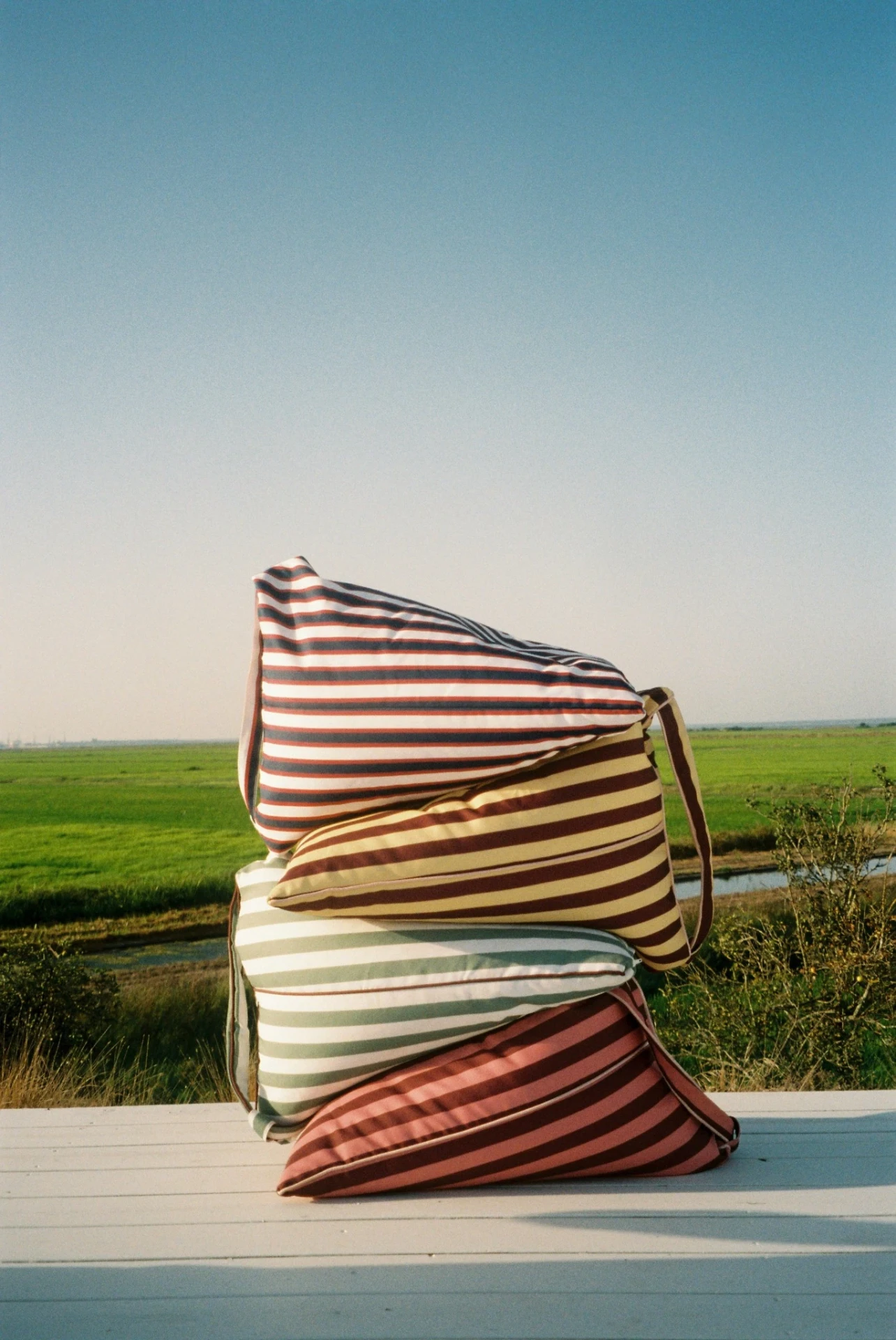 Four LIELOW colorways stacked in a field